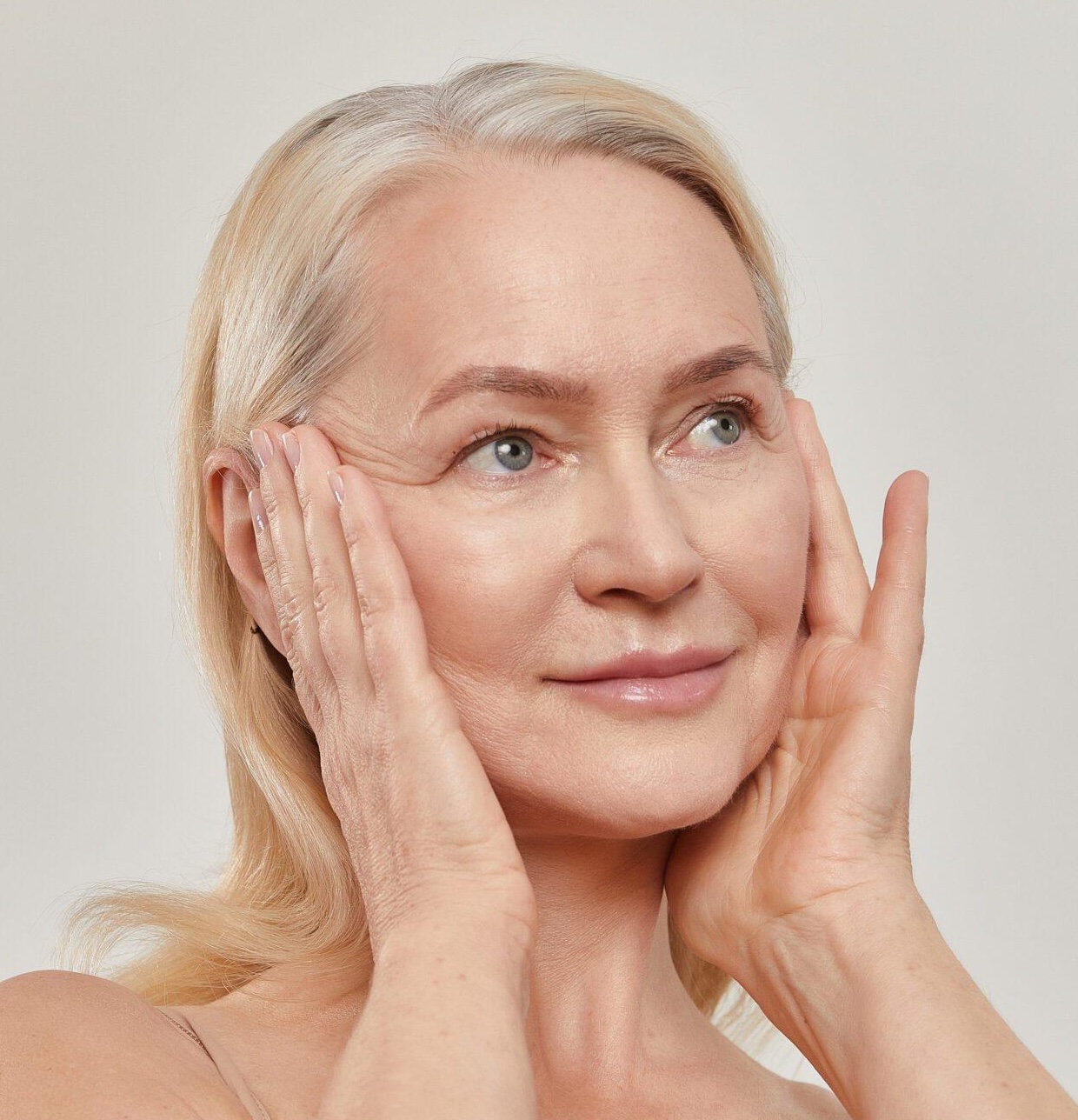 Editorial portrait illustrating the face and neck area